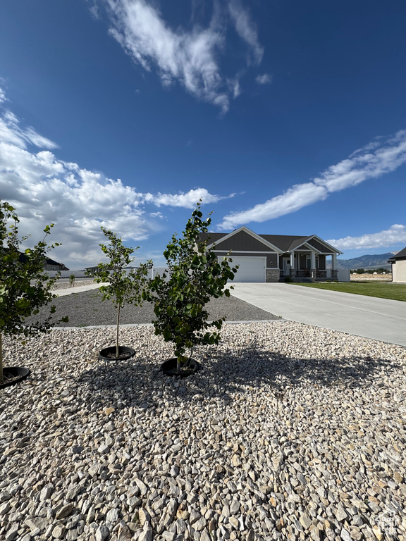 View of front of property featuring driveway and an attached garage
