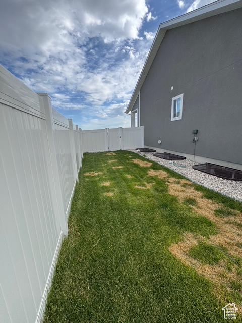 Fenced backyard with a gate