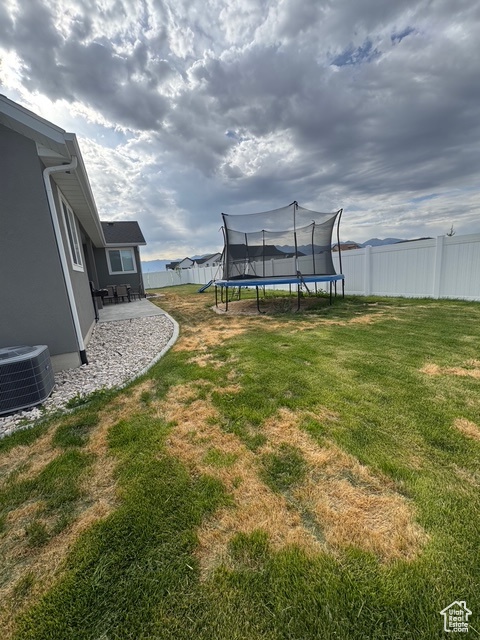 View of yard with a trampoline