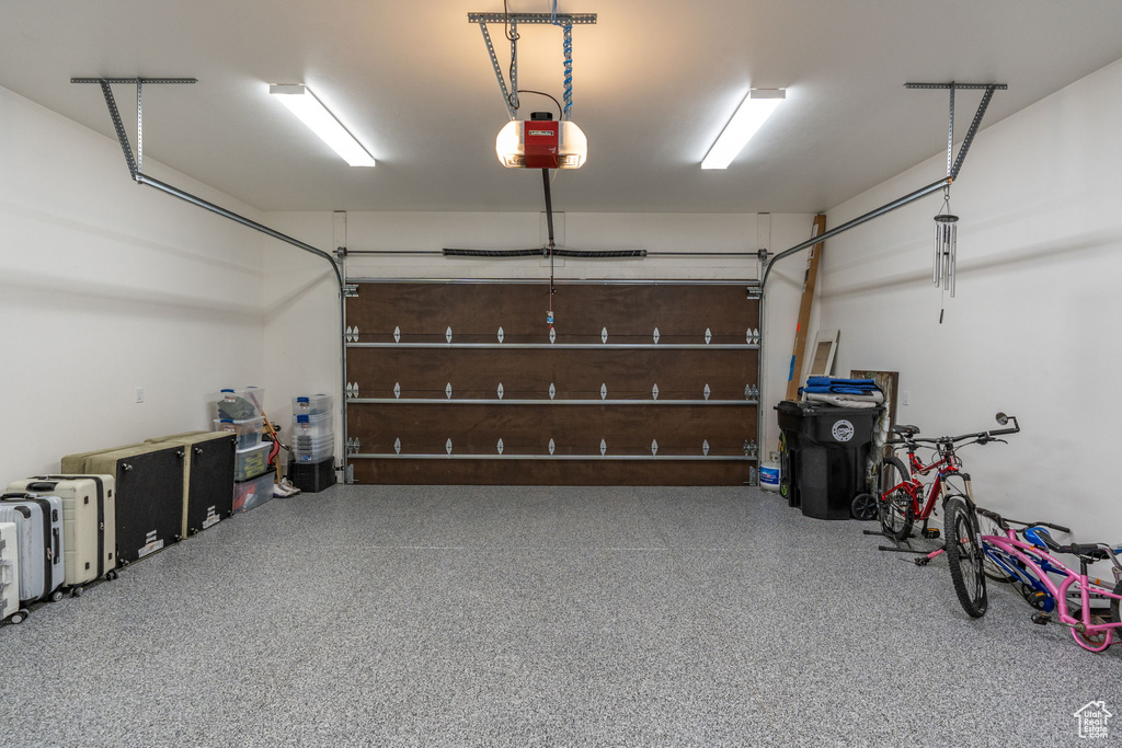 Garage featuring a garage door opener