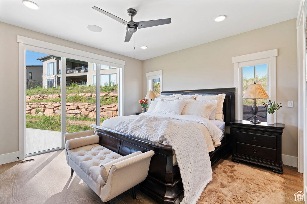 Bedroom featuring light wood-type flooring, access to outside, recessed lighting, and ceiling fan