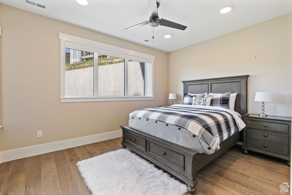 Bedroom featuring wood finished floors, recessed lighting, and a ceiling fan