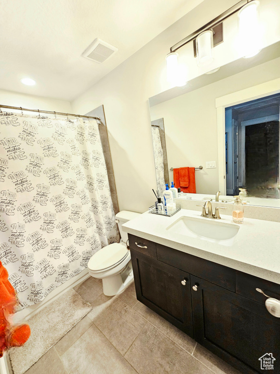 Full bath with vanity, tile patterned flooring, and a shower with shower curtain