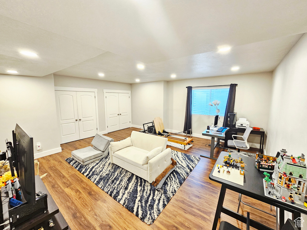 Living area featuring recessed lighting and wood finished floors