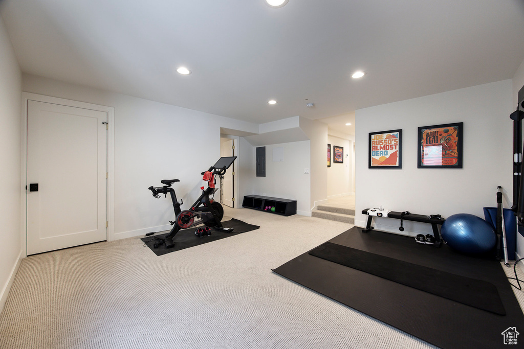 Workout area with carpet floors, recessed lighting, and electric panel