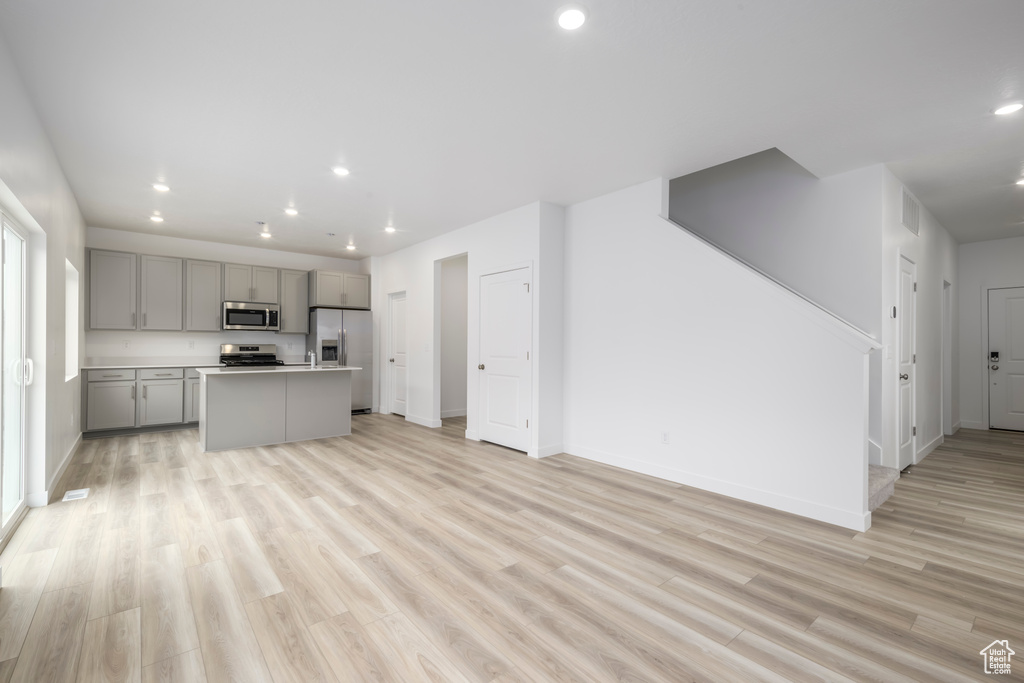 Unfurnished living room featuring recessed lighting and light wood-type flooring