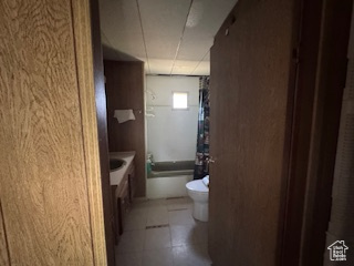 Full bath with vanity and tile patterned floors