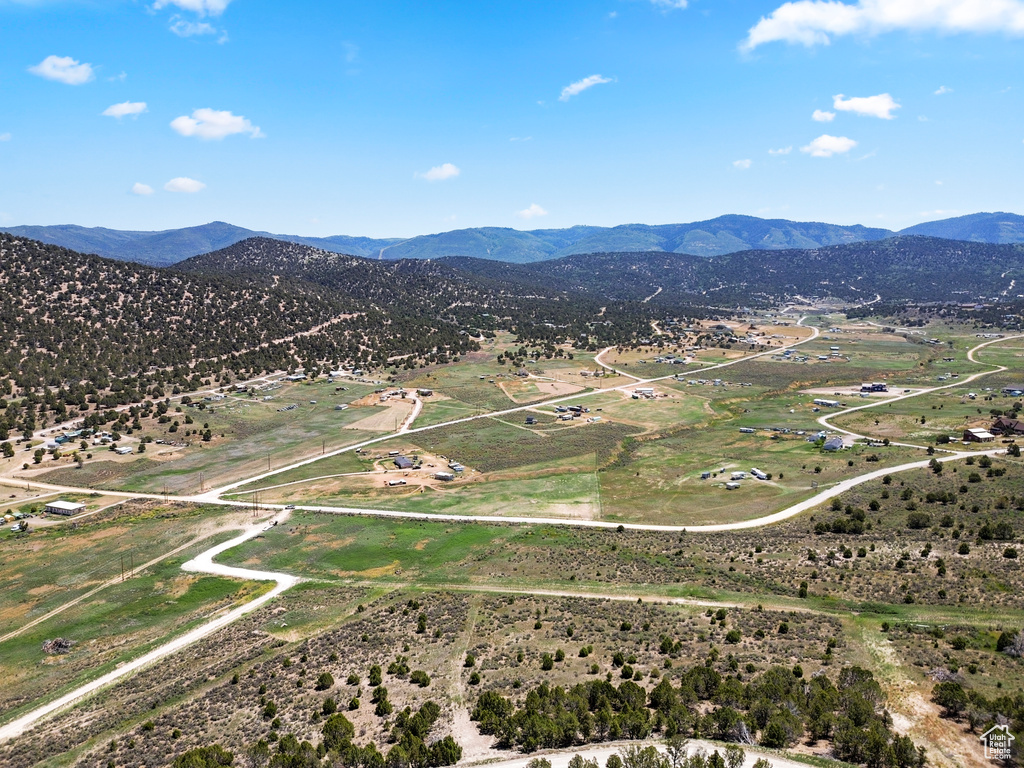 Aerial view of sparsely populated area featuring a mountainous background