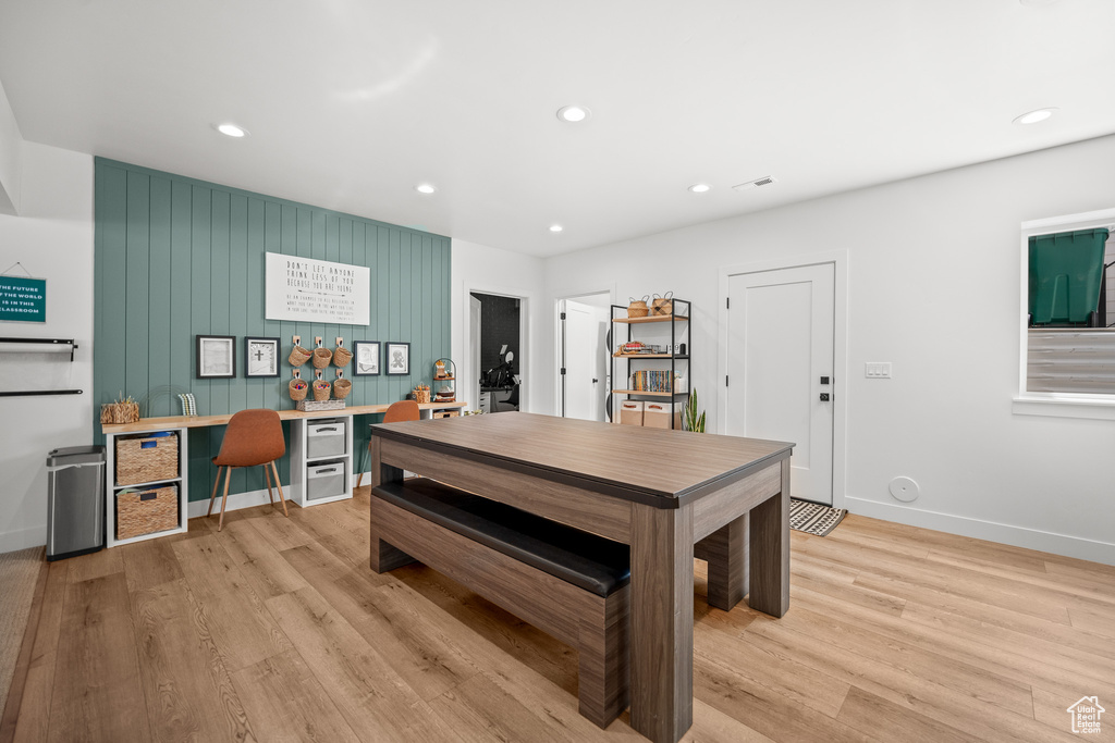 Dining area featuring an office area, light wood finished floors, and recessed lighting