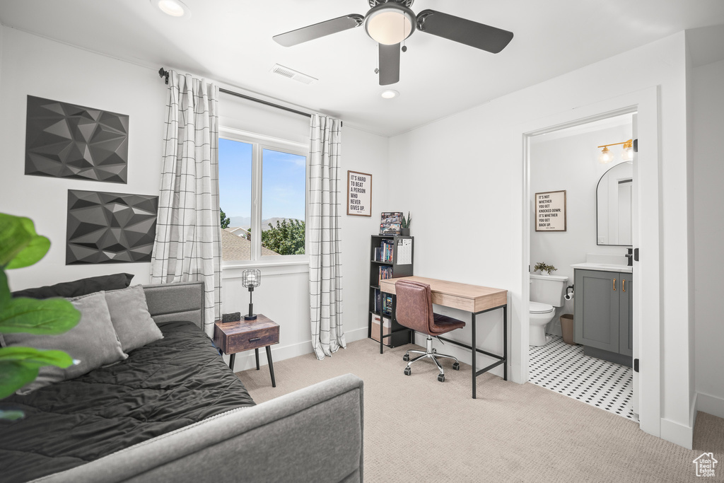 Office space with ceiling fan, light carpet, and recessed lighting