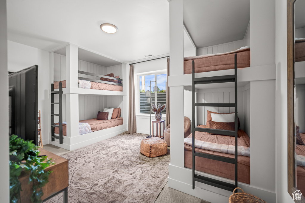 Bedroom with carpet floors and baseboards