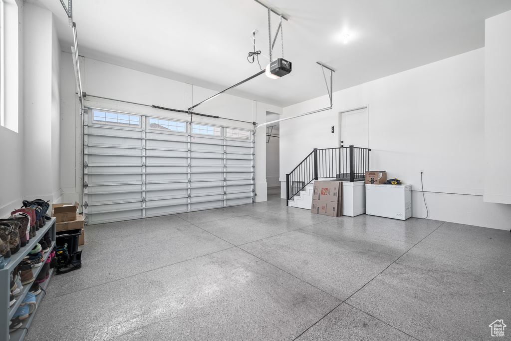 Garage featuring a garage door opener