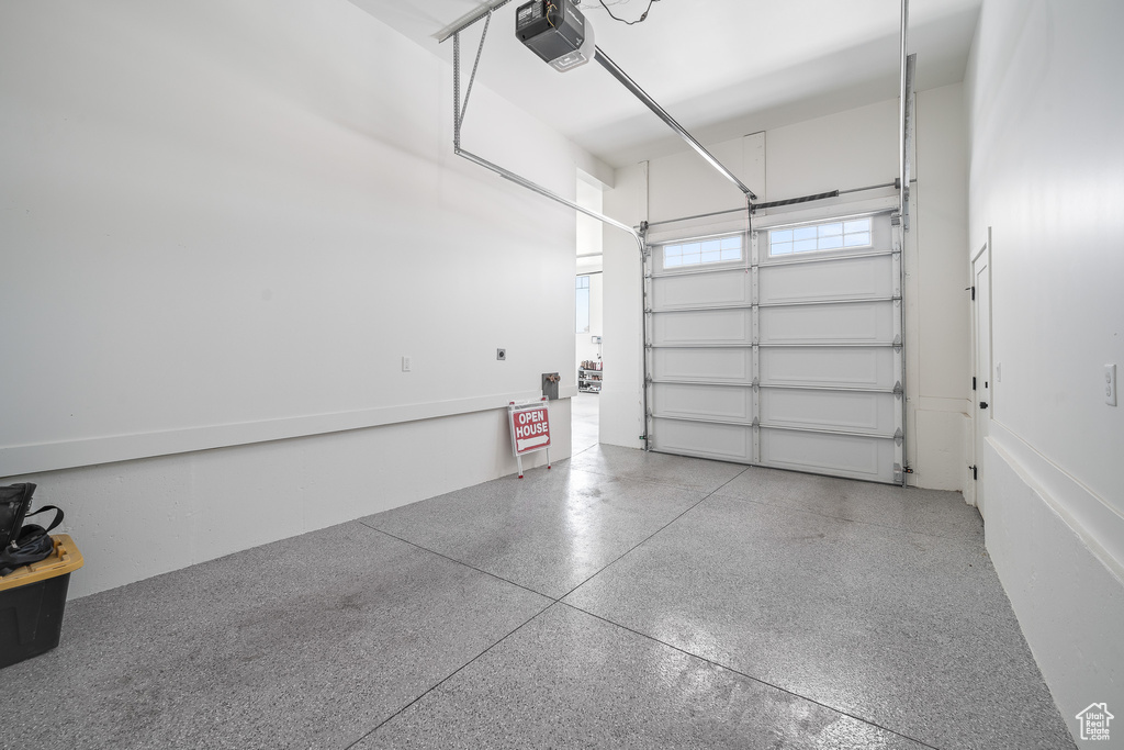 Garage featuring a garage door opener