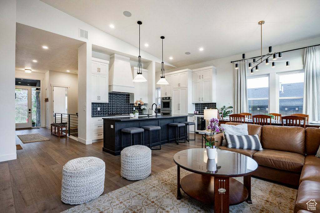 Living room featuring wood finished floors and recessed lighting