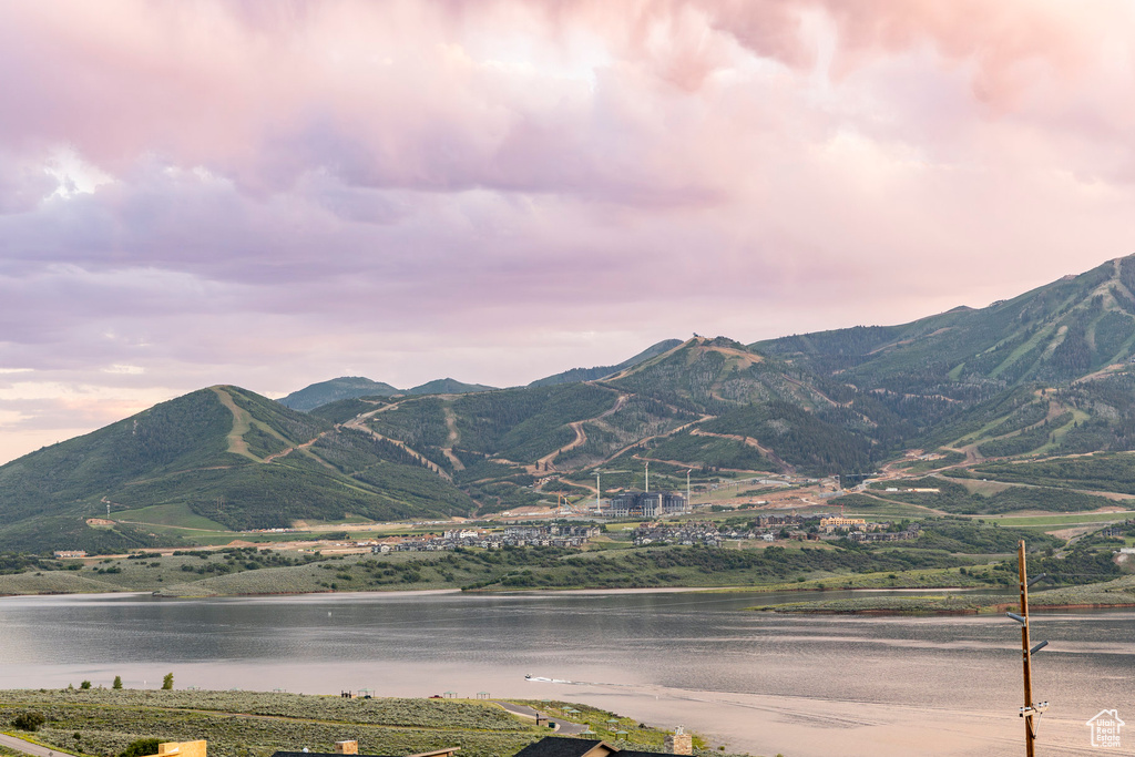 View of mountain backdrop with a nearby body of water