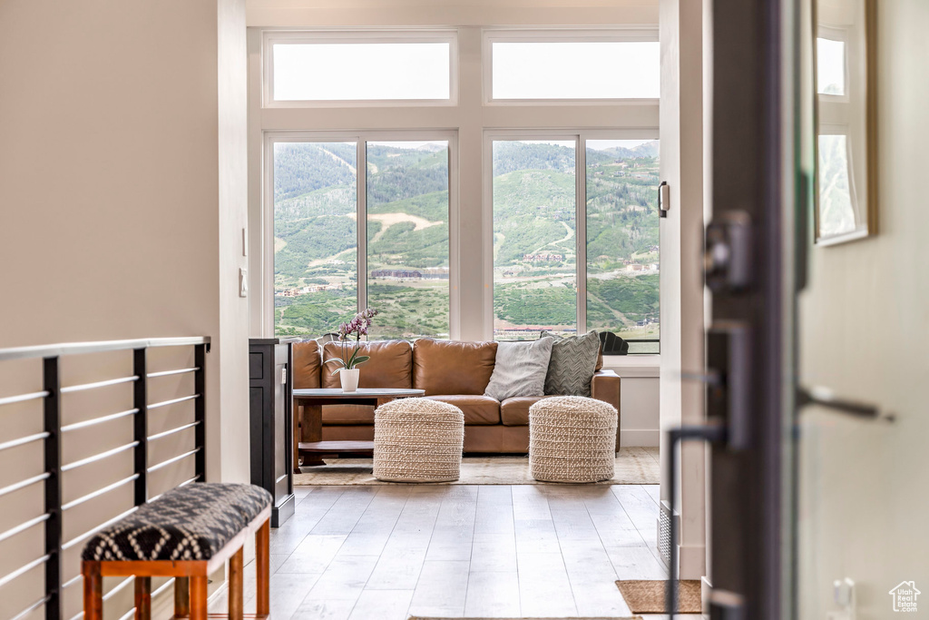 Sitting room featuring healthy amount of natural light and wood finished floors