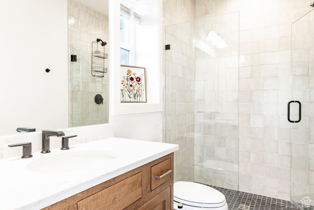 Bathroom with vanity and a stall shower