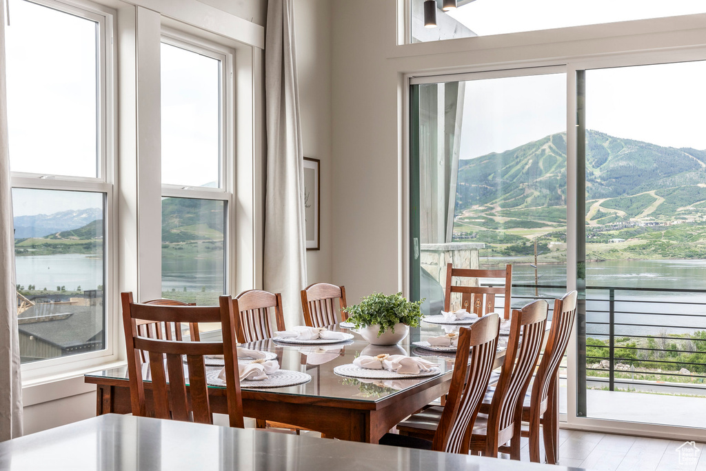 Dining room featuring a water and mountain view
