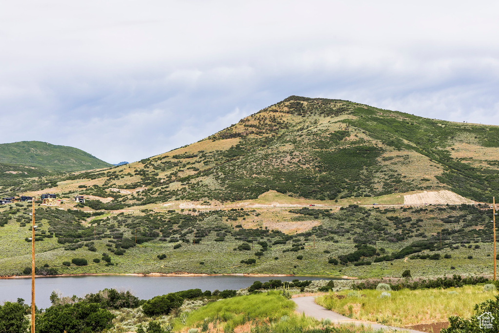 View of mountain backdrop featuring a large body of water
