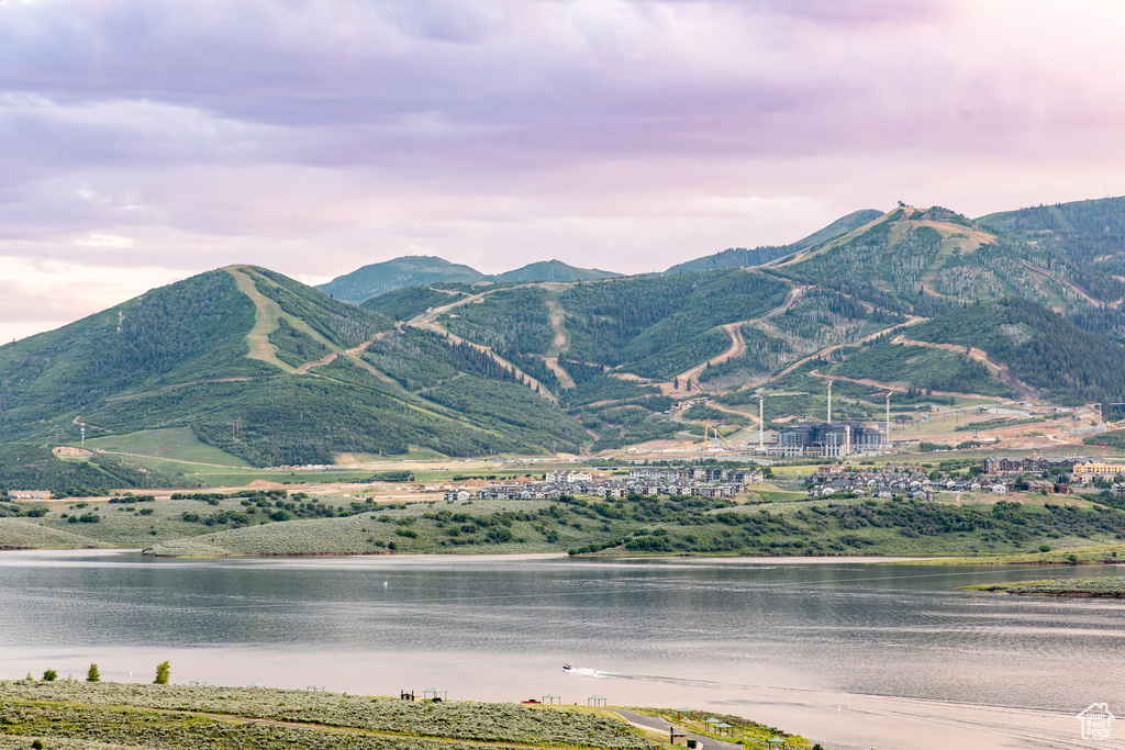 View of mountain backdrop featuring a nearby body of water