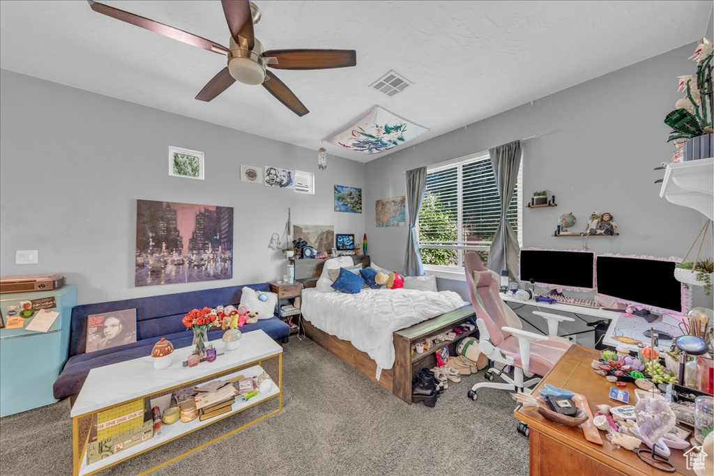 Bedroom with carpet and ceiling fan