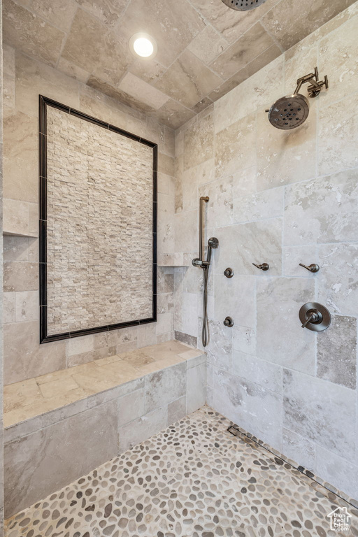 Bathroom featuring a tile shower