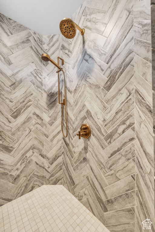 Full bath featuring tiled shower