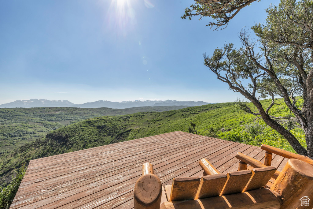 Wooden terrace featuring a mountain view
