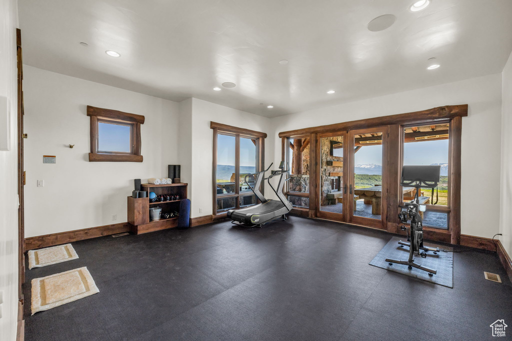Workout room with french doors and recessed lighting