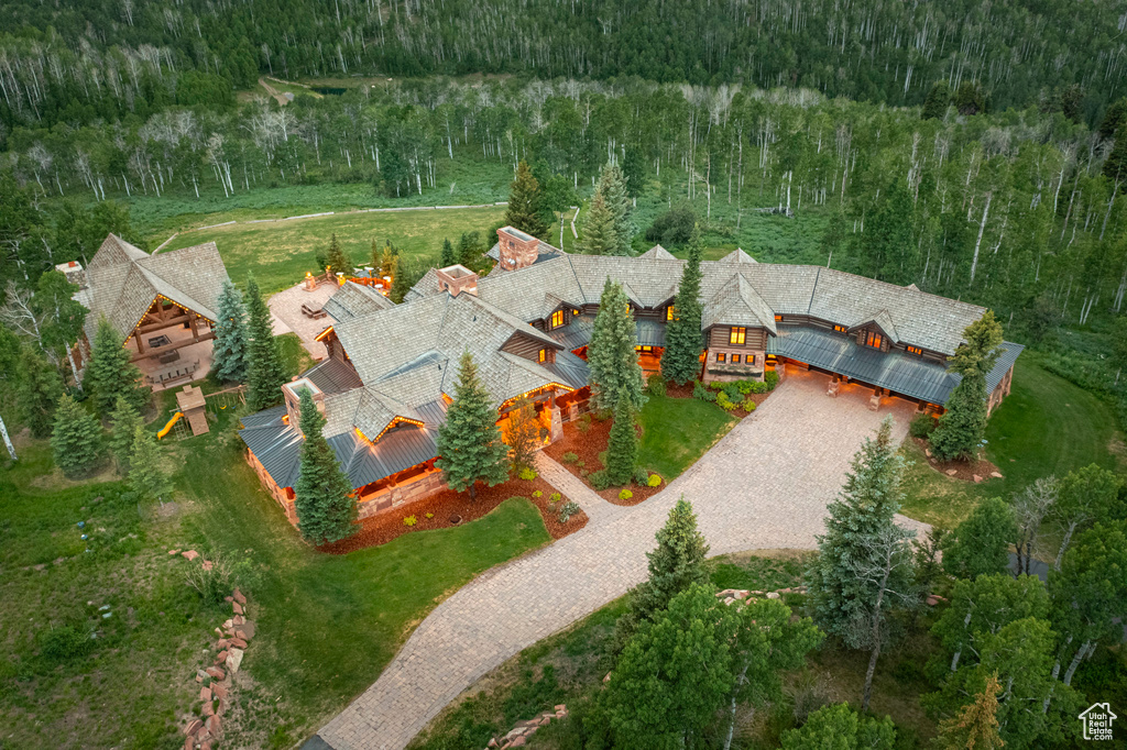 View of subject property featuring a forest