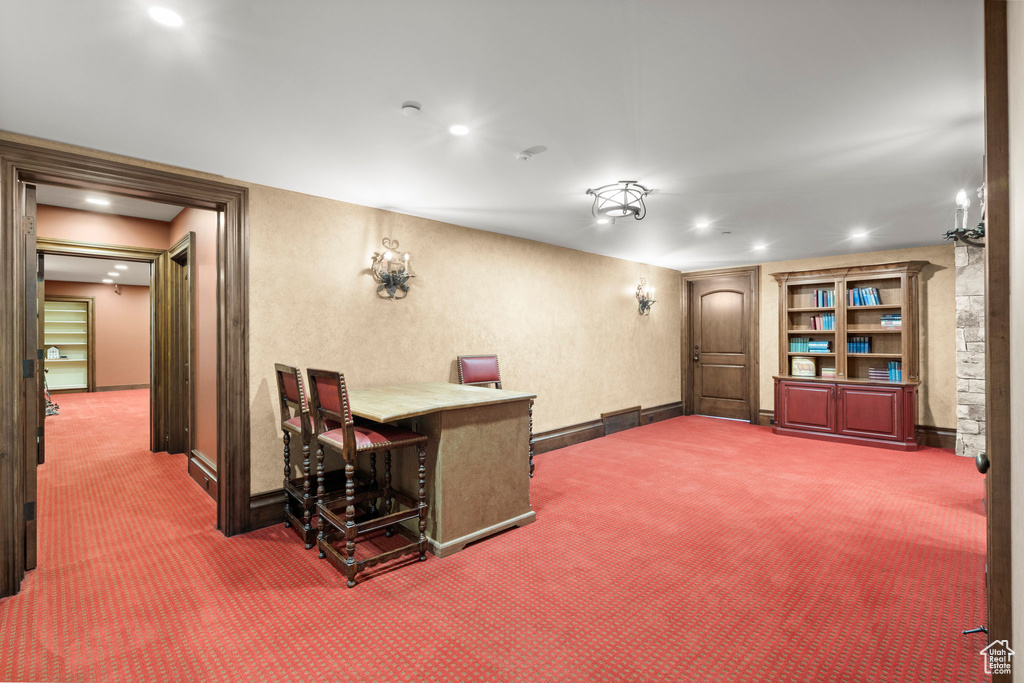Home office with carpet floors and recessed lighting