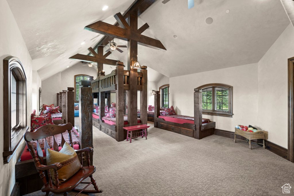 Carpeted bedroom with beamed ceiling, high vaulted ceiling, and recessed lighting
