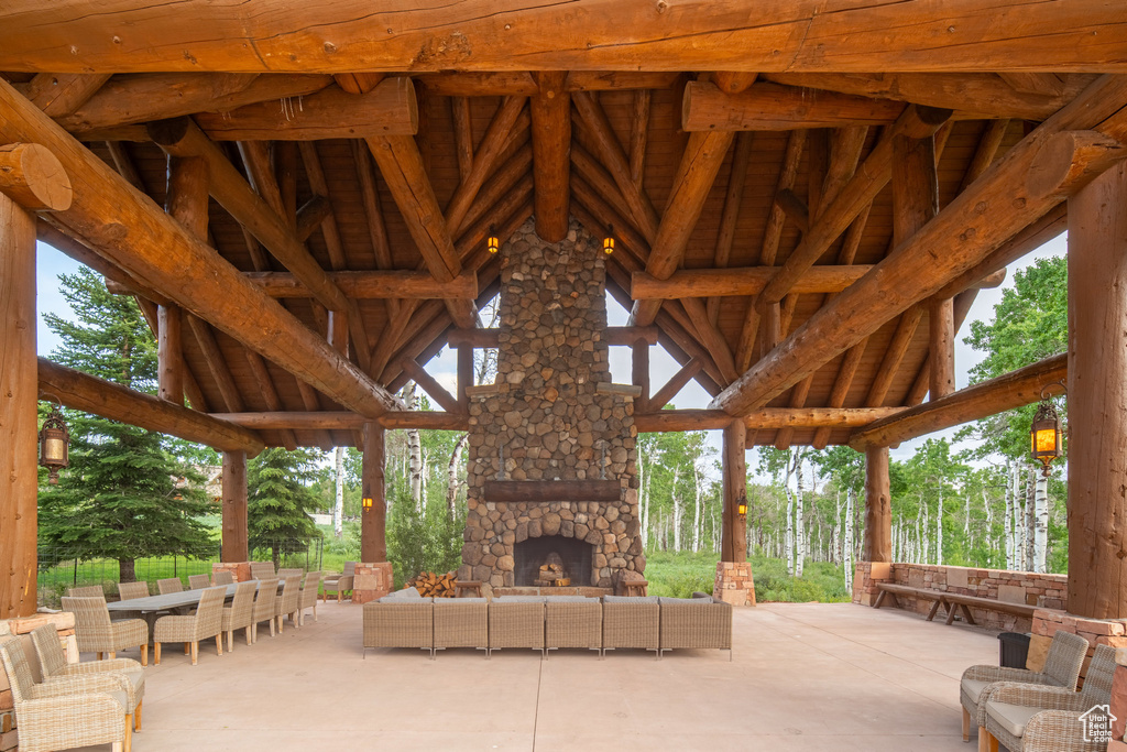 View of patio / terrace featuring an outdoor living space with a fireplace and outdoor dining space