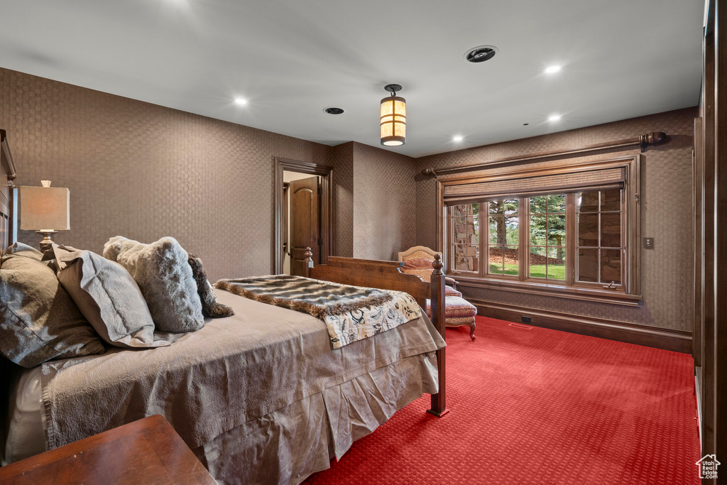 Carpeted bedroom with recessed lighting
