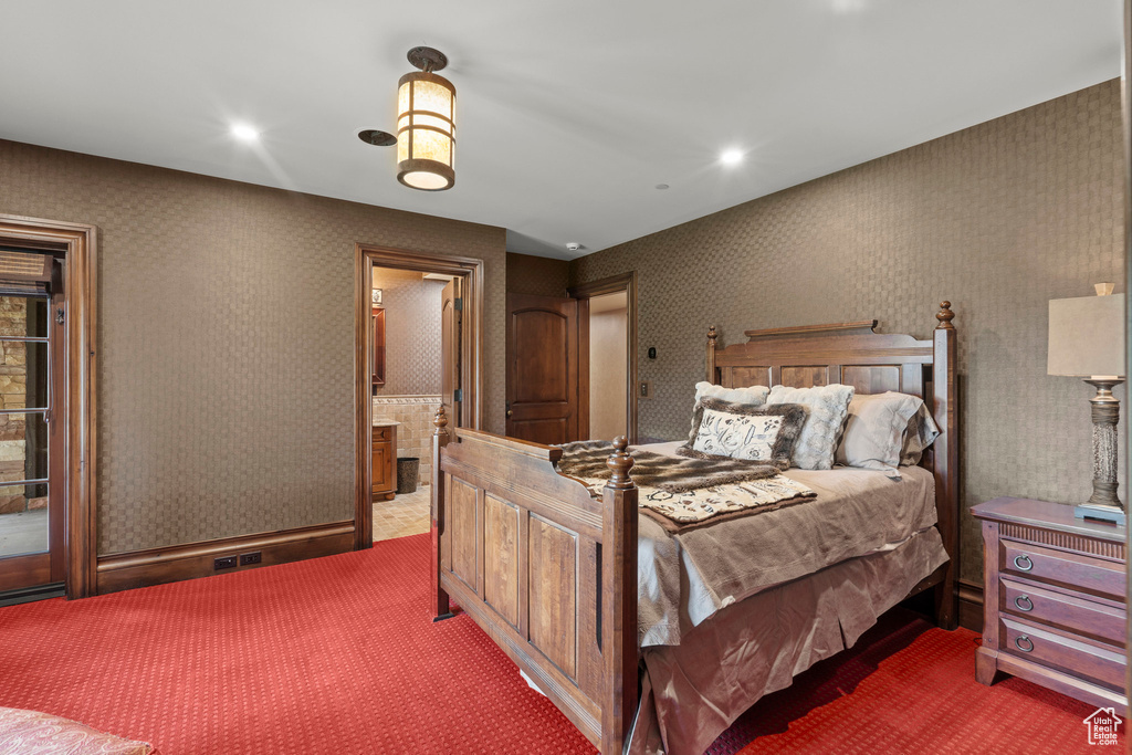 Carpeted bedroom featuring recessed lighting, connected bathroom, and wallpapered walls