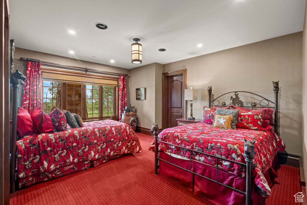 Carpeted bedroom with baseboards and recessed lighting