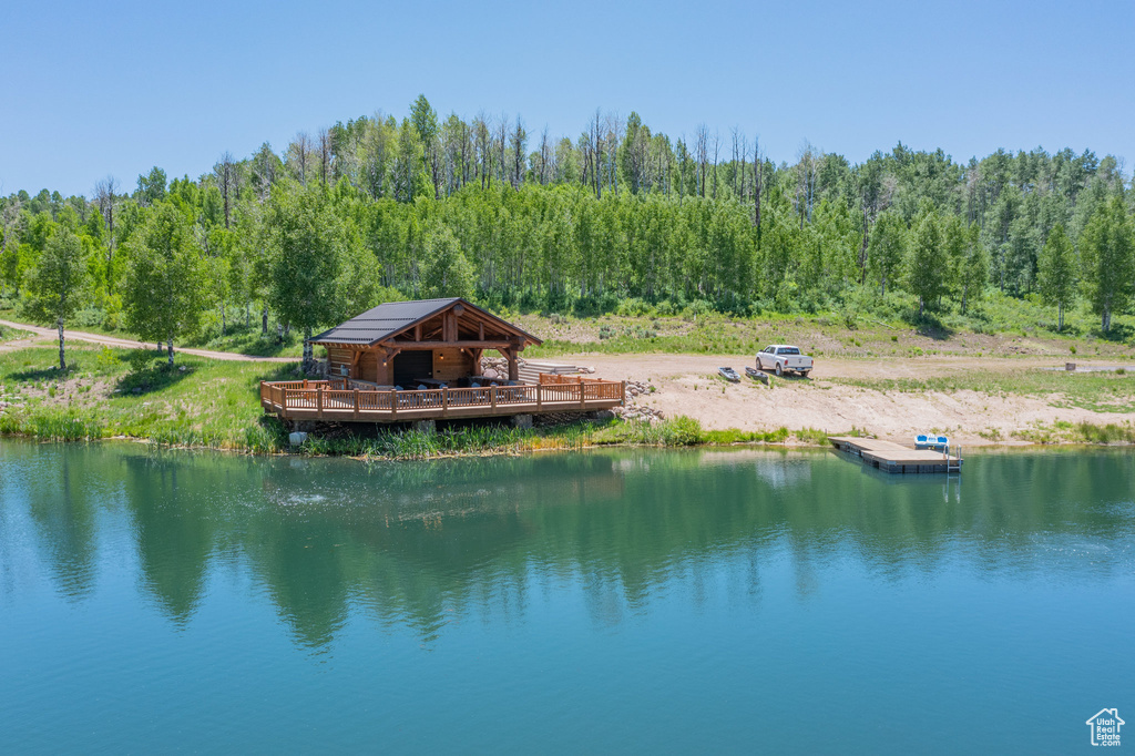 Water view featuring a heavily wooded area