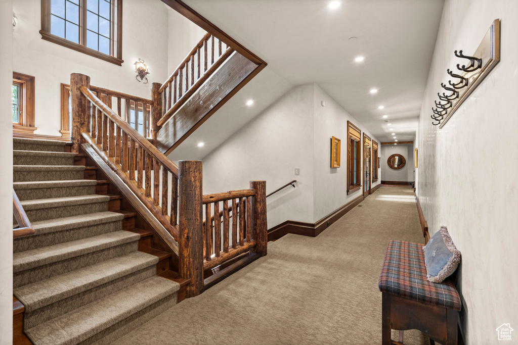 Stairway featuring carpet flooring and recessed lighting