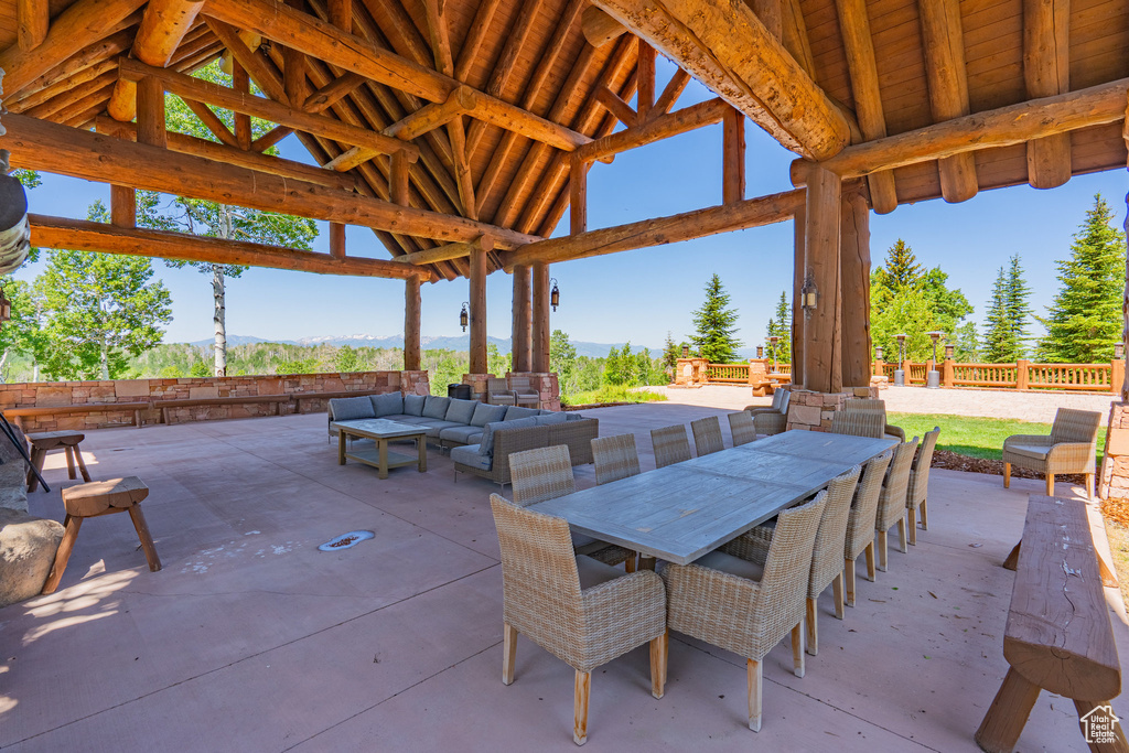 View of patio with a gazebo, outdoor lounge area, and a mountain view