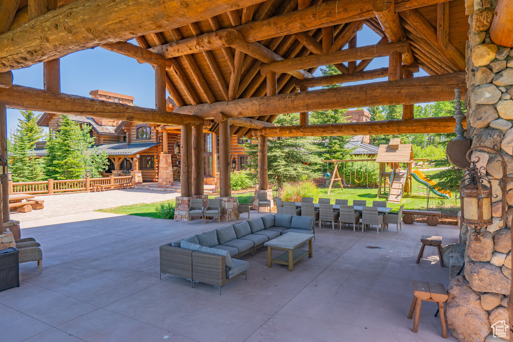 View of patio featuring an outdoor living space, a gazebo, and outdoor dining area