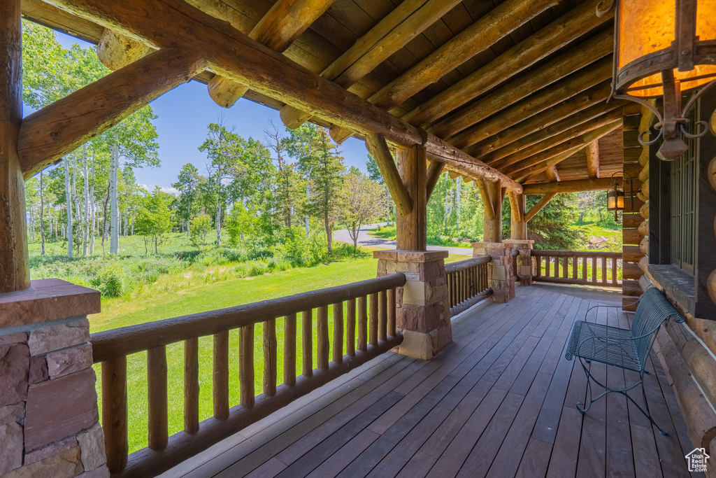 Deck featuring a yard