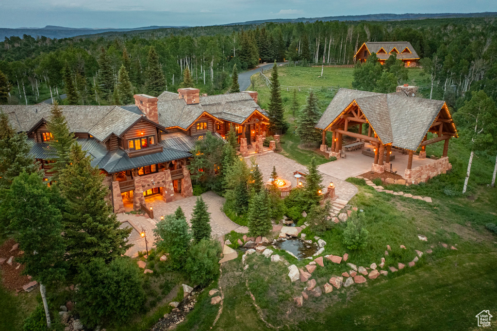 View of subject property with a heavily wooded area