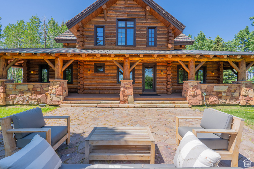 View of patio / terrace featuring an outdoor hangout area and a gazebo