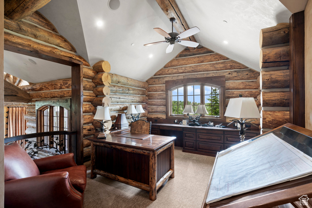 Office with rustic walls, a ceiling fan, and light colored carpet