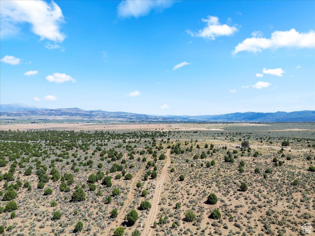 View of mountain backdrop with a desert landscape and rural landscape