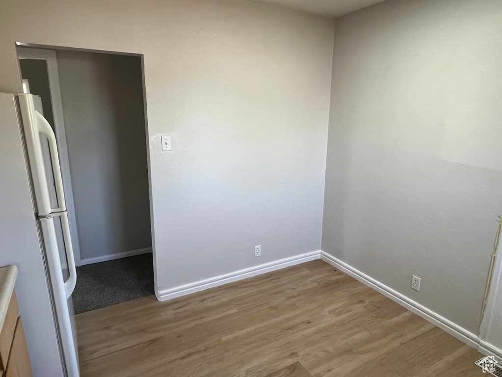 Spare room with wood finished floors and baseboards