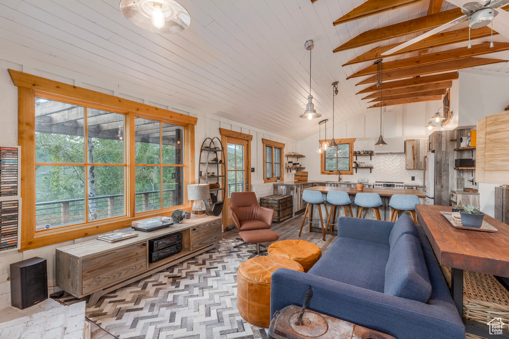 Living area featuring healthy amount of natural light and a ceiling fan