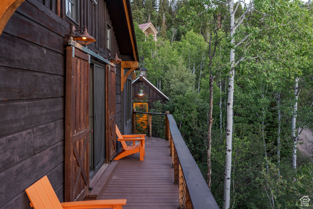 Wooden deck with a view of trees