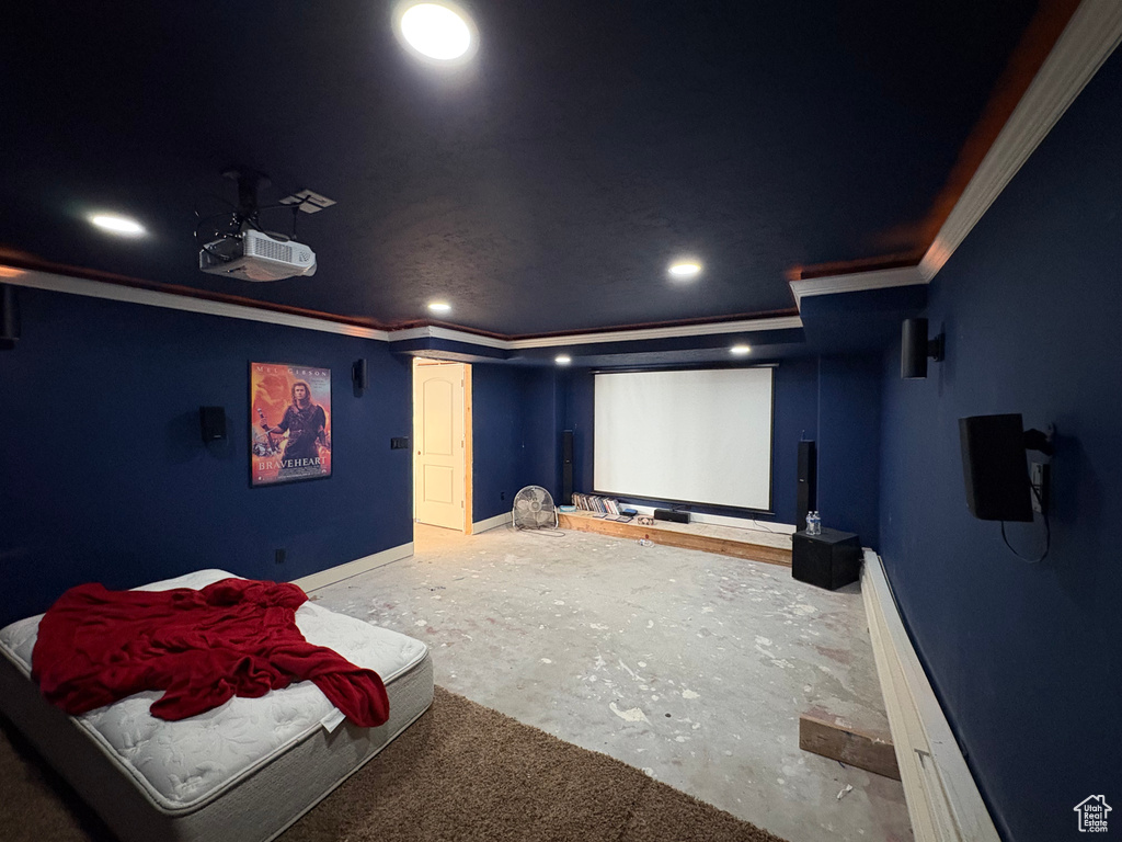 Home theater with ornamental molding and recessed lighting