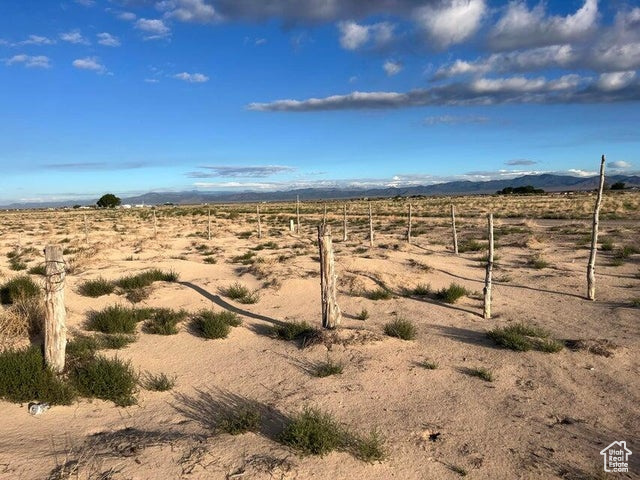 View of yard with view of desert, a view of countryside, and a mountain view